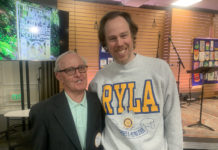 PHOTO: Mitch Lehman | The San Marino Weekly | Lee Zuckerman was the keynote speaker at last Thursday's meeting of the Rotary Club of San Marino. Zuckerman is wearing a sweatshirt from RYLA, an organization sponsored by Rotary, that he said he had not worn for over 30 years. At left is Phil Ryan, who was Zuckerman's track and cross country coach at SMHS.