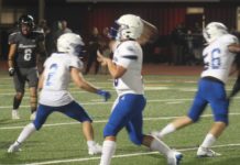 PHOTO: Mitch Lehman | San Marino Weekly | Brady Beck uses solid pass protection from Mikey Yessaian, left, and Gannon Gill, right. Beck tossed four touchdown passes to lead the Titans to a 42-6 win over Rosemead last Friday evening and improve San Marino’s record to 3-0.