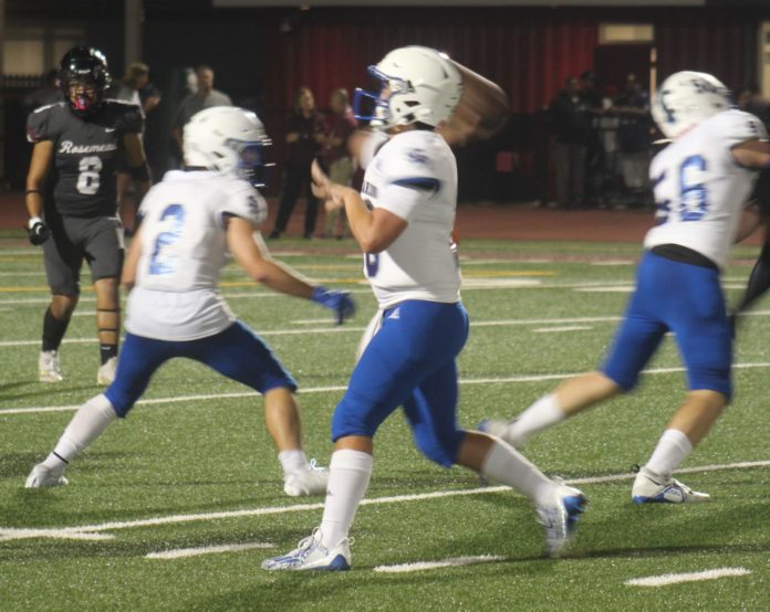 PHOTO: Mitch Lehman | San Marino Weekly | Brady Beck uses solid pass protection from Mikey Yessaian, left, and Gannon Gill, right. Beck tossed four touchdown passes to lead the Titans to a 42-6 win over Rosemead last Friday evening and improve San Marino’s record to 3-0.