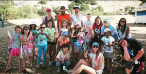 PHOTO: provided by Titanium Robotics | San Marino Weekly | Members of Titanium Robotics with campers at Camp Del Corazon.