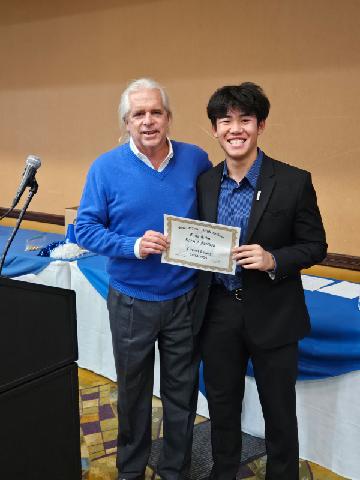 PHOTO: Mitch Lehman | San Marino Weekly | Clement Truong receives the True Titan Award from Mitch Lehman at the SMHS Football banquet.