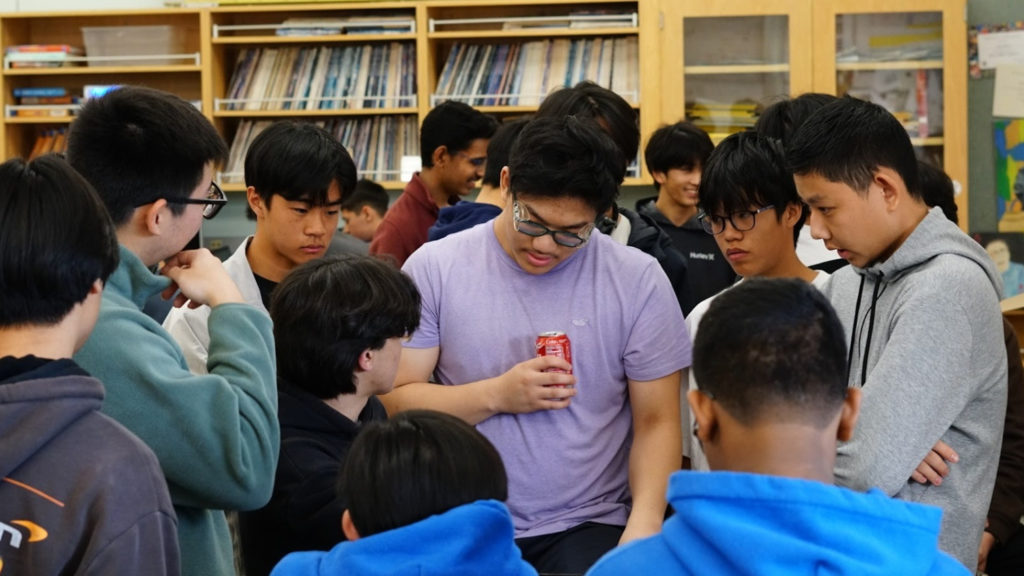 PHOTO: Sean Trisnadi | Titanium Robotics | San Marino Weekly | Titanium Robotics and Absolute Value Robotics teams concentrate on the game video in order to plan for upcoming competitions.